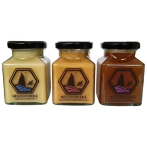 Our Honey Collection featuring Forest Honey, Late Summer Honey and True Ling Heather Honey in decorative square jars,.